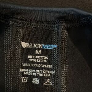 Men's Black Compression Shirt
Alignmed Size M zipped front.